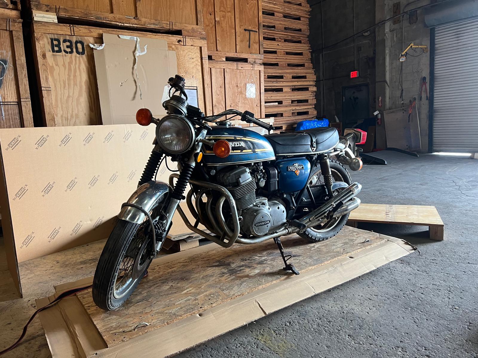 Classic car secured inside container for international shipping