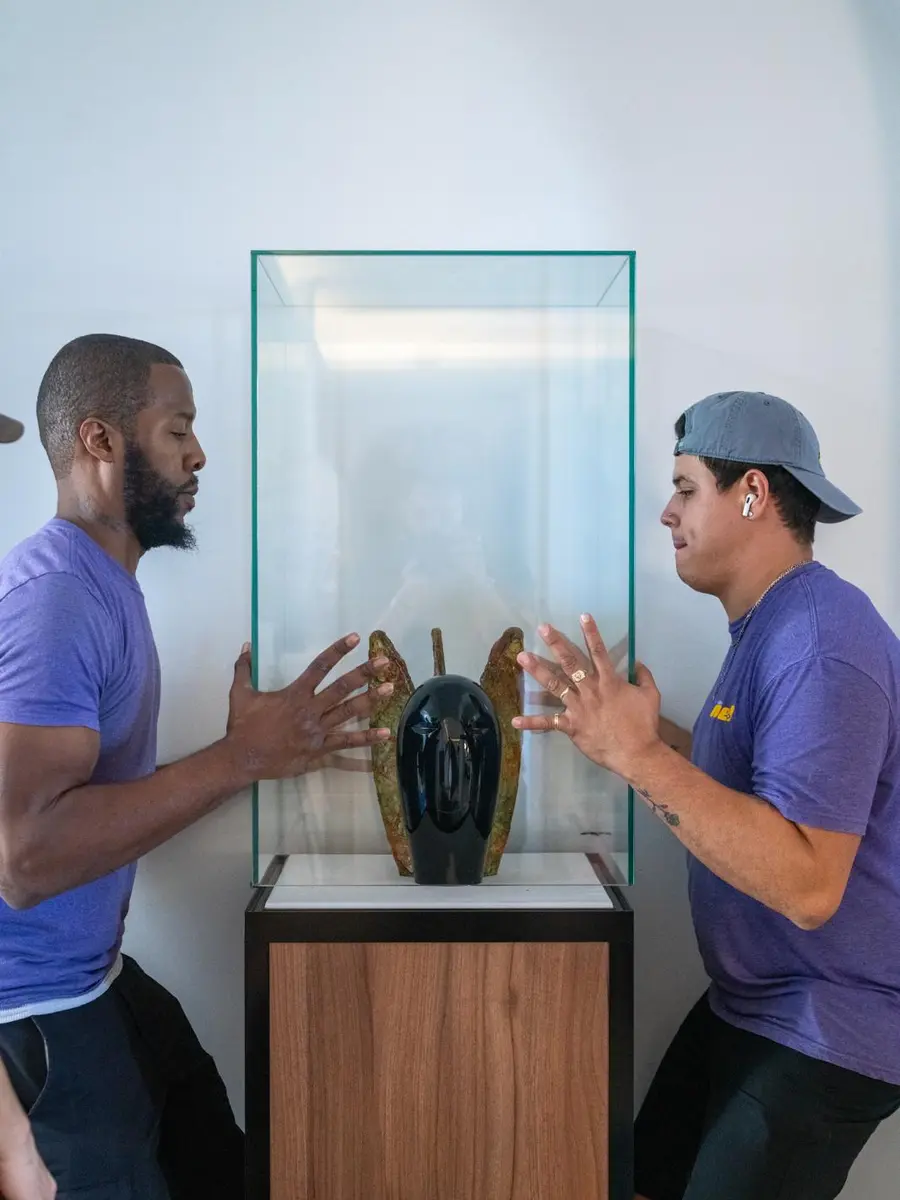 Nobel Relocation movers carefully handling a glass sculpture
