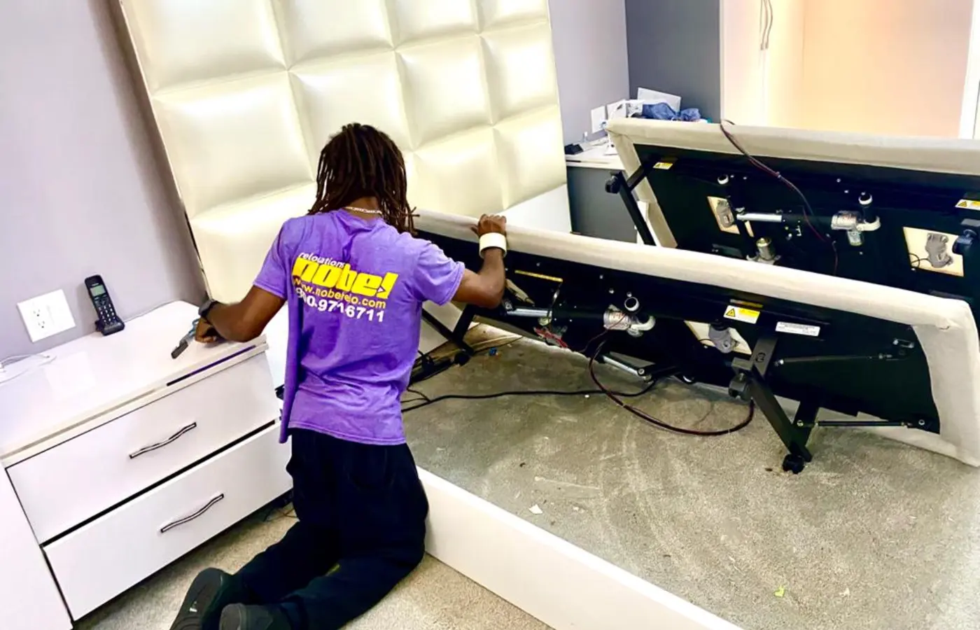 Nobel Relocation mover carefully disassembling furniture for a long-distance or international move