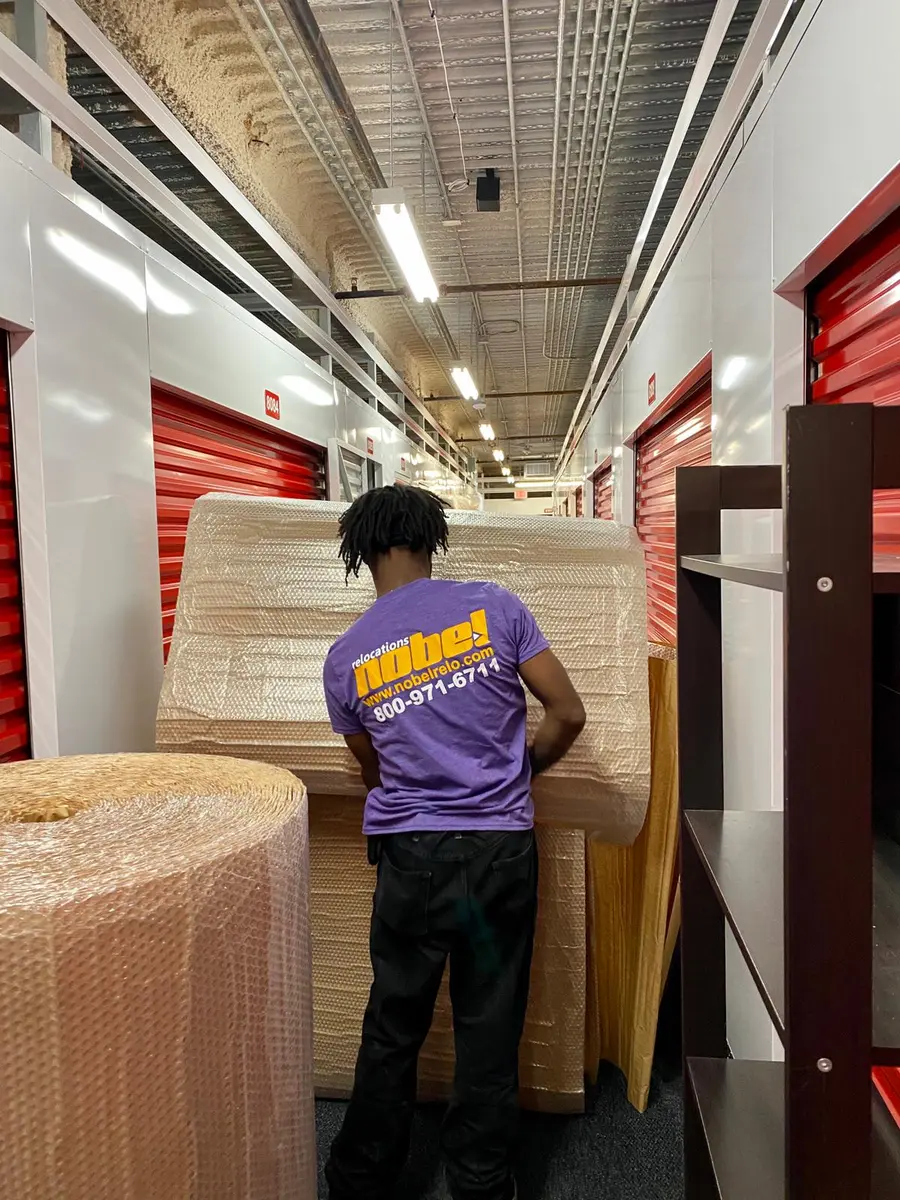 Nobel Relocation mover handling professionally protected furniture in secure storage