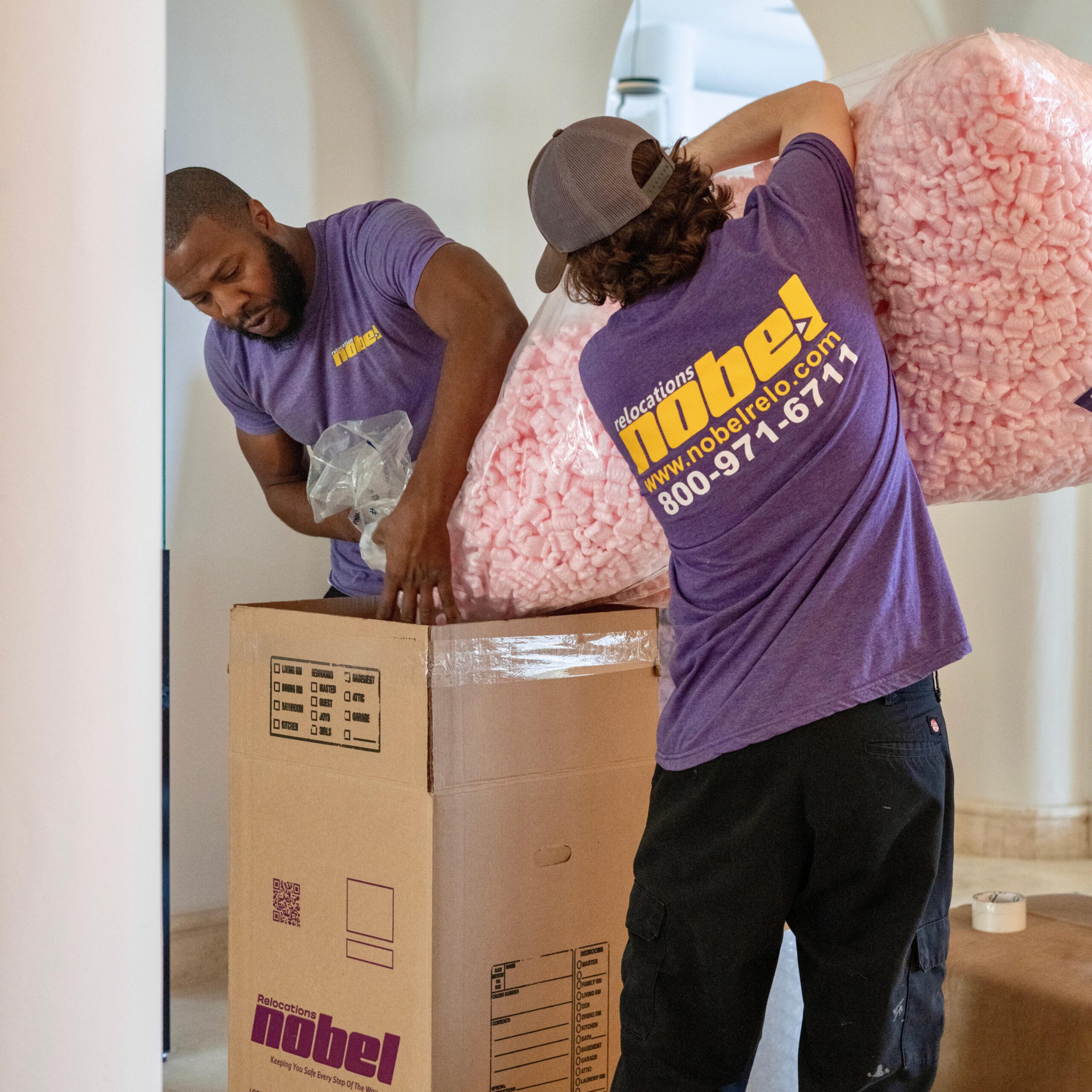 Nobel Relocation crew professionally packing household goods for a move to Brazil