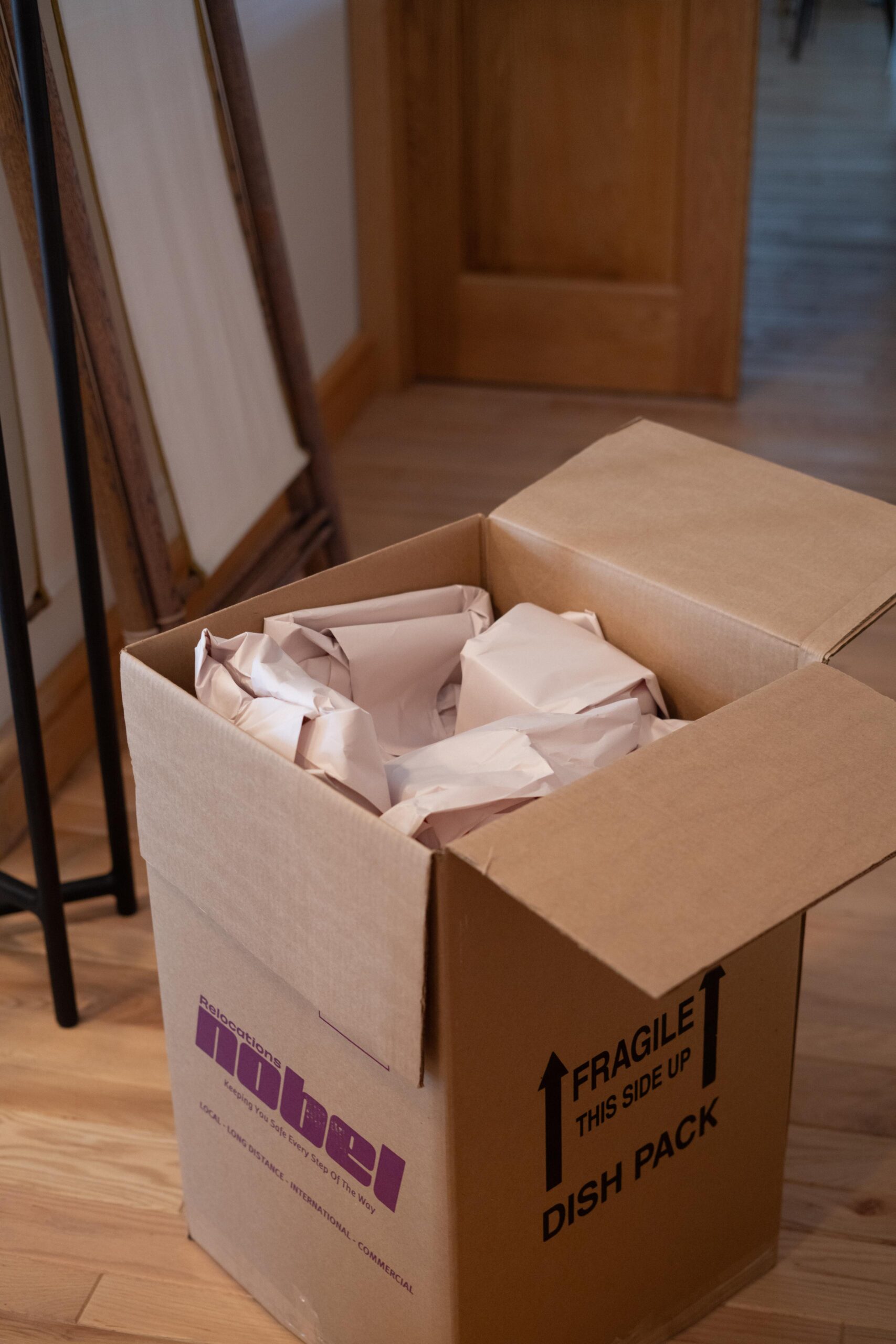 Fragile household items professionally packed in a Nobel Relocation dish pack box