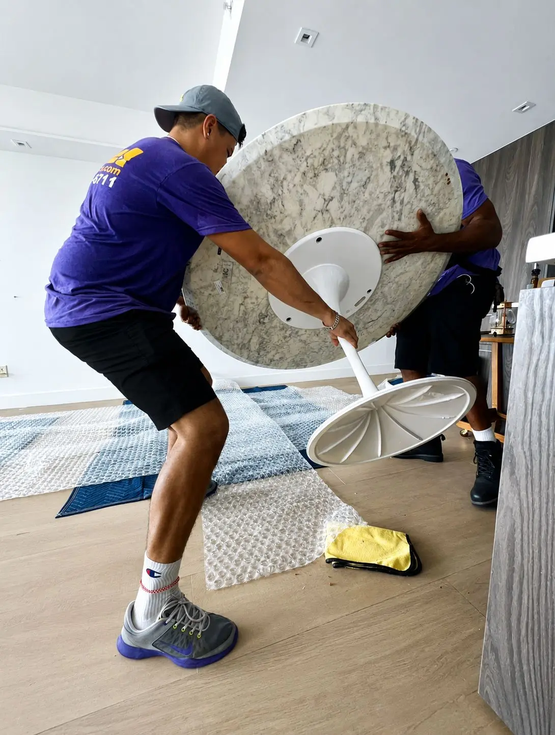 Nobel Relocation movers carefully handling specialty furniture