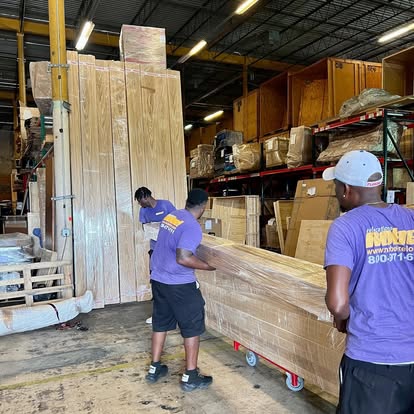 Nobel Relocation movers preparing furniture for storage in Miami